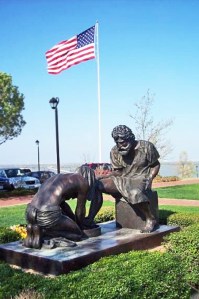 This is a statue at my university, Dallas Baptist University.  It captures Jesus washing a disciple's feet. 